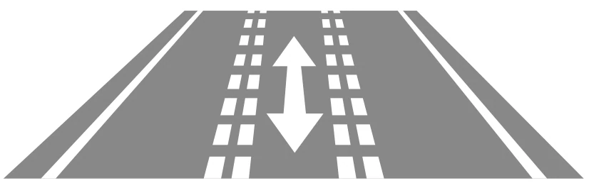 Dos líneas discontinuas delimitan un carril reversible